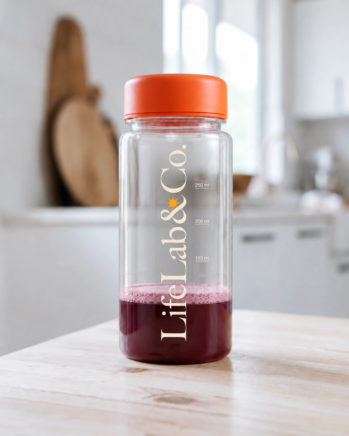 The LifeLab&Co. shaker with about 100 mL of berry SleepSHAKE drink on a kitchen bench